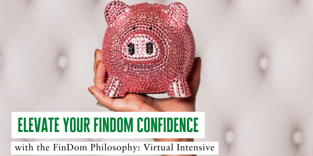 Hand holding up rhinestone piggy bank